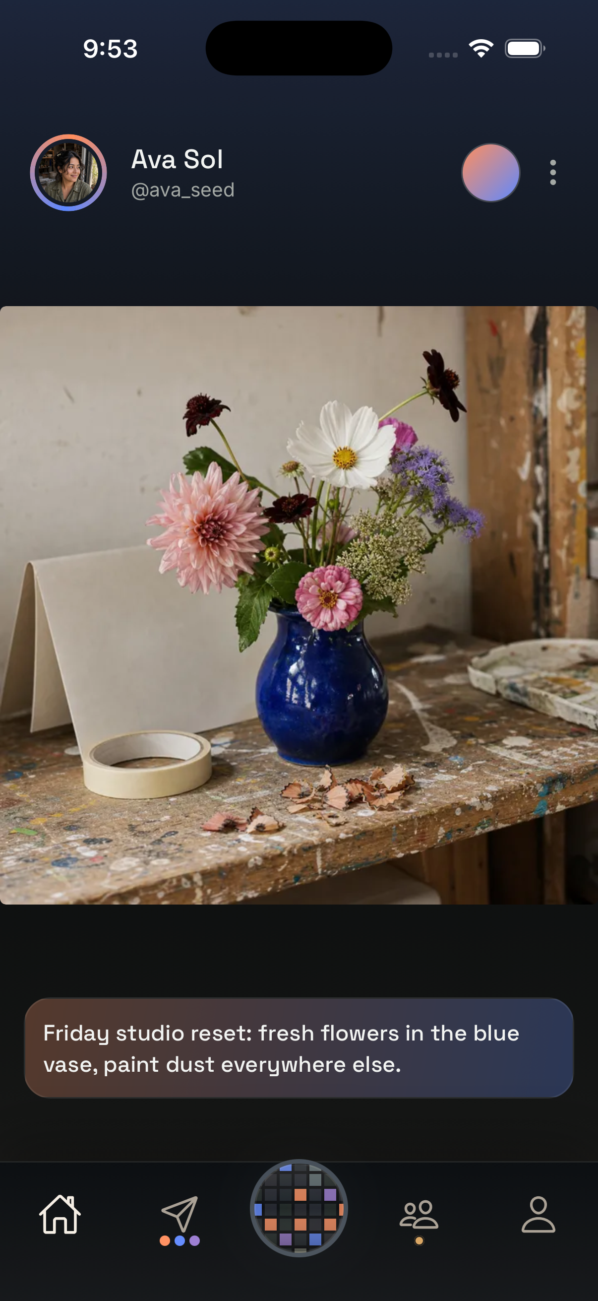 Real fictional Ava Sol studio post showing flowers in a blue vase on a paint-marked worktable, with the matching Friday studio caption beneath it.
